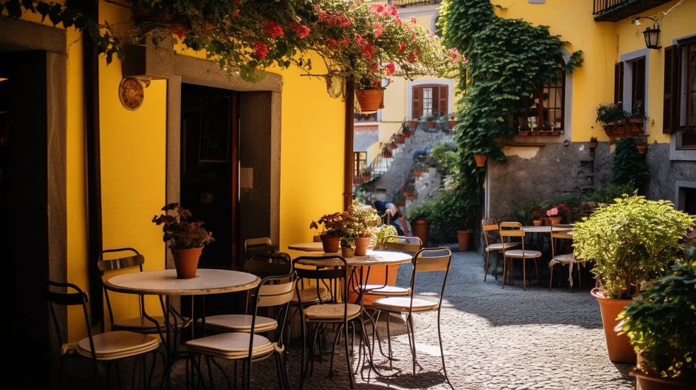 a patio with tables and chairs and a table