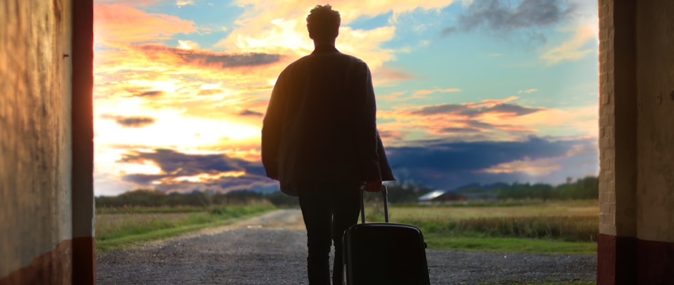 Man holding luggage photo