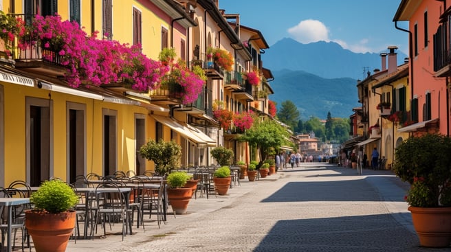A street in Menaggio with a row of tables and chairs
