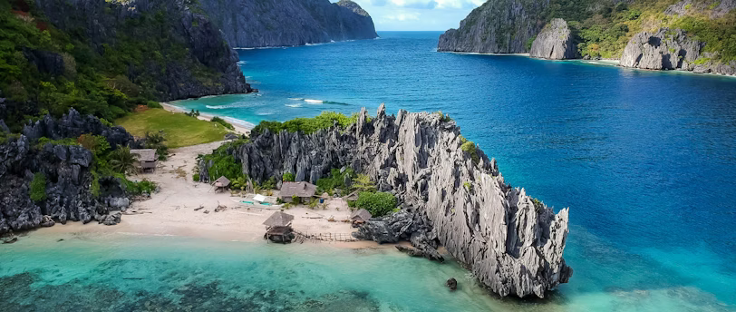 aerial photo of body of water between mountains aerial photo of body of water between mountains