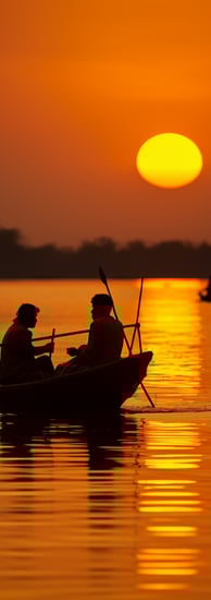 sunrise view of a river with fishing