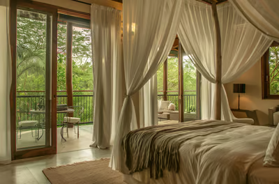bedroom and balcony of an eco-friendly retreat in Costa Rica