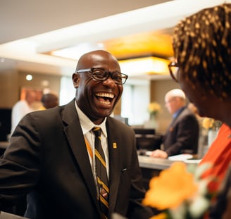 A man in a suit and tie smiling at a woman