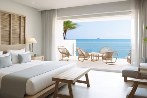 A modern hotel room with wooden floors and a large bed.