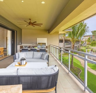 a balcony with a couch and a table