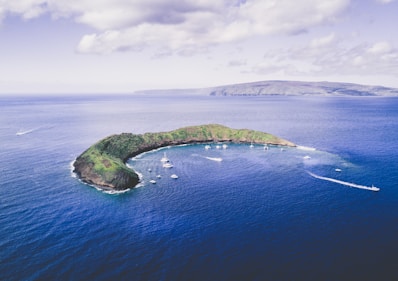 body of water under white cloudy sky during daytime photo