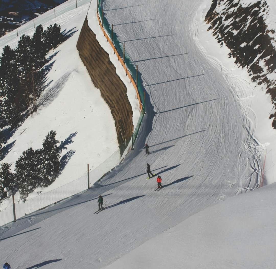 photo of people ice skating during daytime