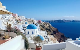"Iconic Blue Domes of Oia, Santorini Overlooking the Sea