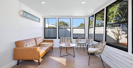 A living room with a couch and a table in hollywood beach, florida A living room with a couch and a table in hollywood beach, florida