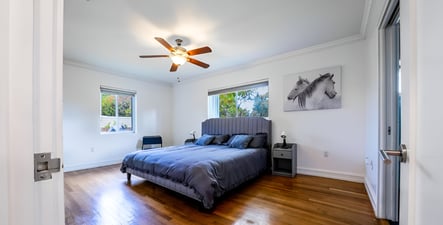 A bedroom with a bed and a ceiling fan in hollywood beach, florida A bedroom with a bed and a ceiling fan in hollywood beach, florida