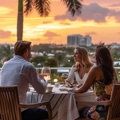 A couple of people sitting at a table with wine glasses in hallandale beach, florida A couple of people sitting at a table with wine glasses in hallandale beach, florida