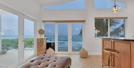 A living room with a couch and a bar in hollywood beach, florida A living room with a couch and a bar in hollywood beach, florida