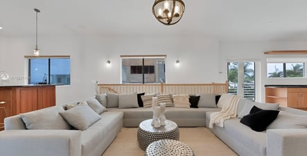 A living room with a couch and a table in hollywood beach, florida A living room with a couch and a table in hollywood beach, florida