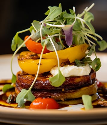a plate of food with vegetables and sauce