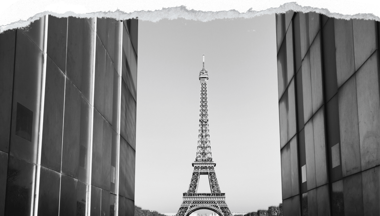 view of eiffel tower between two skyscrapers