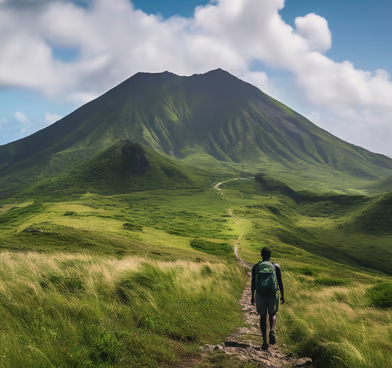 a man walking on a path in the mountains a man walking on a path in the mountains