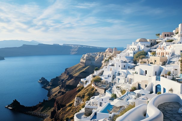 A panoramic view from the hilltop in Oia, Santorini, showcasing the stunning blue sea and whitewashed buildings.