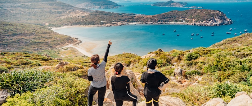 Three friends chill out top of the hill