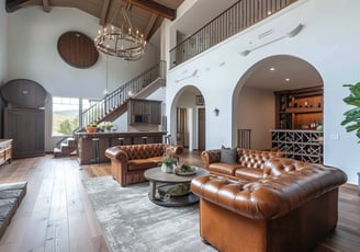 An establishing shot of a living room in a spacious home rental in Napa Valley with wine bar.