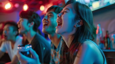 a group of Western tourists in a vIdeoke VIP room singing their hearts out.