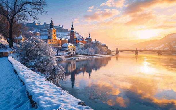 A picturesque sunset casts a warm glow over the cityscape of Zurich, Switzerland, highlighting its stunning architecture
