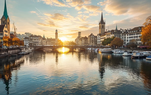 A picturesque sunset casts a warm glow over the cityscape of Zurich, Switzerland, highlighting its stunning architecture