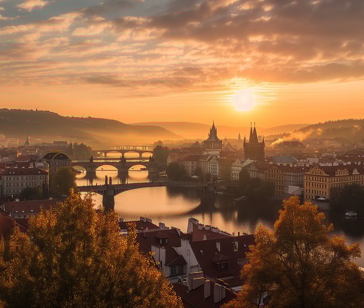 Sunset over Prague skyline, with silhouettes of iconic buildings and colorful sky in the background