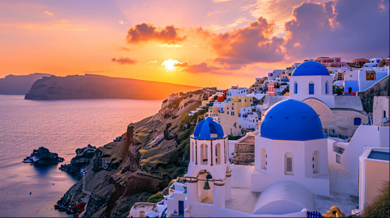 a sunset over a cliff overlooking a city