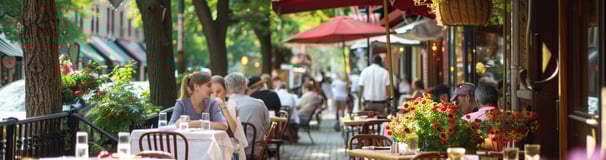 A couple of people sitting at tables outside in long island, new york A couple of people sitting at tables outside in long island, new york