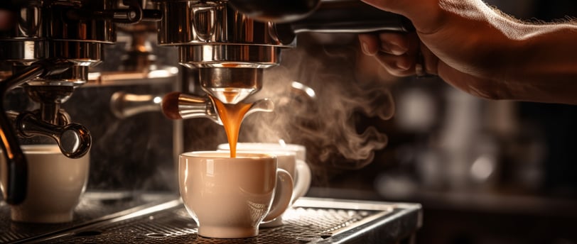 a cup of coffee in an espresso machine