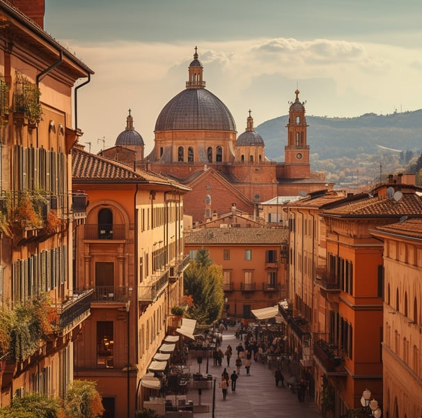 A panoramic view of Bologna, Italy, showcasing its historic architecture and vibrant city life under a clear blue sky