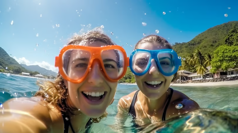 Tourists snorkeling the clear waters of Champagne Beach in Dominica. Tourists snorkeling the clear waters of Champagne Beach in Dominica.
