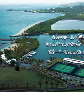 A hotel with a view of the ocean and a beach A hotel with a view of the ocean and a beach