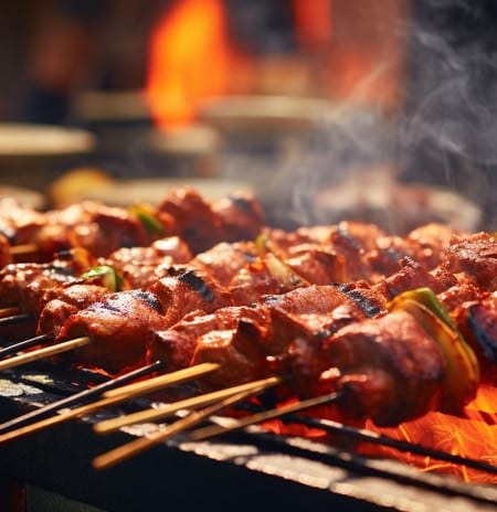 a grill with skewers on it