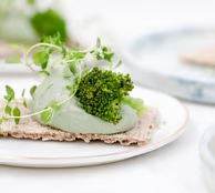green vegetable on white ceramic plate green vegetable on white ceramic plate