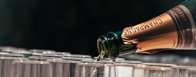 Champagne pouring on glass Champagne pouring on glass