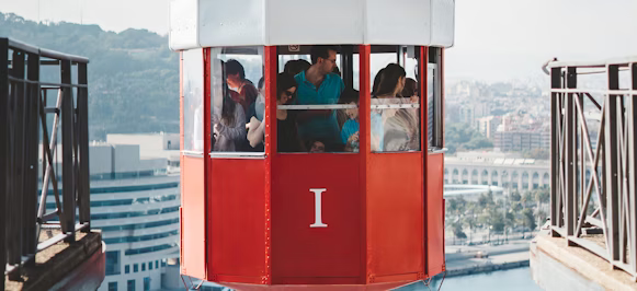 people riding on cable cart people riding on cable cart
