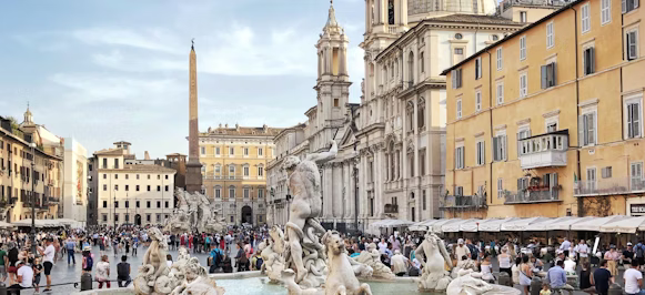 people walking and sitting near water fountain during daytime people walking and sitting near water fountain during daytime