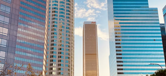 white and blue high rise building white and blue high rise building