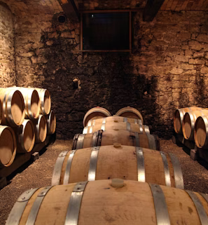 brown wooden barrels on brown brick wall brown wooden barrels on brown brick wall
