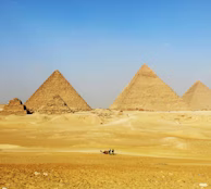a group of pyramids in the desert with a sky background a group of pyramids in the desert with a sky background