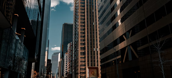 a city street with tall buildings in the background a city street with tall buildings in the background