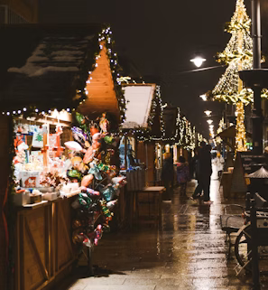 a street with a lot of christmas lights on it a street with a lot of christmas lights on it