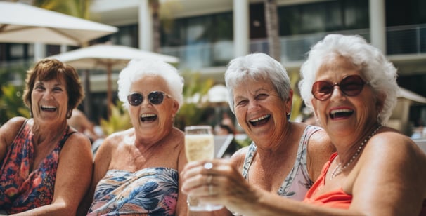 a group of elderly ladies enjoying a drink by the pool of their hotel in Orlando, Florida