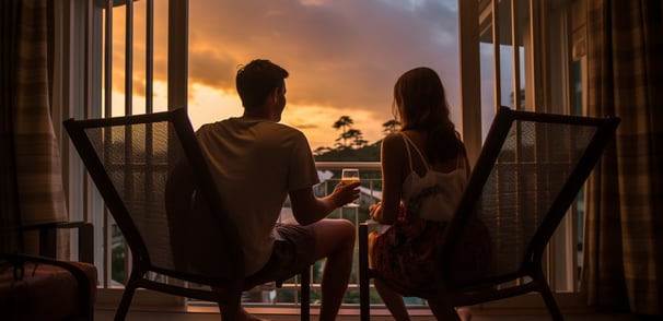 a couple enjoying the sunset view from the balcony of their rental apartment in Orlando, Florida