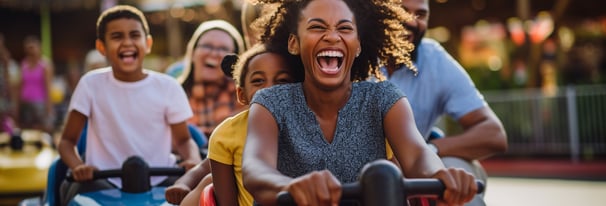 a family having fun in a theme park ride in Orlando, Florida