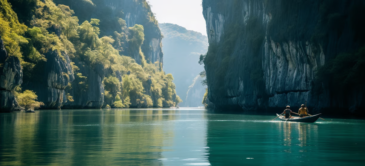 A man in a canoe in the middle of a river A man in a canoe in the middle of a river