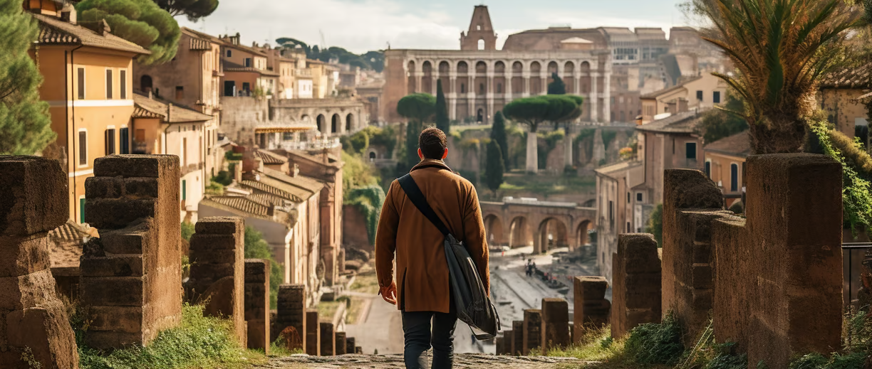 A man walking in the middle of an ancient street in Rome A man walking in the middle of an ancient street in Rome