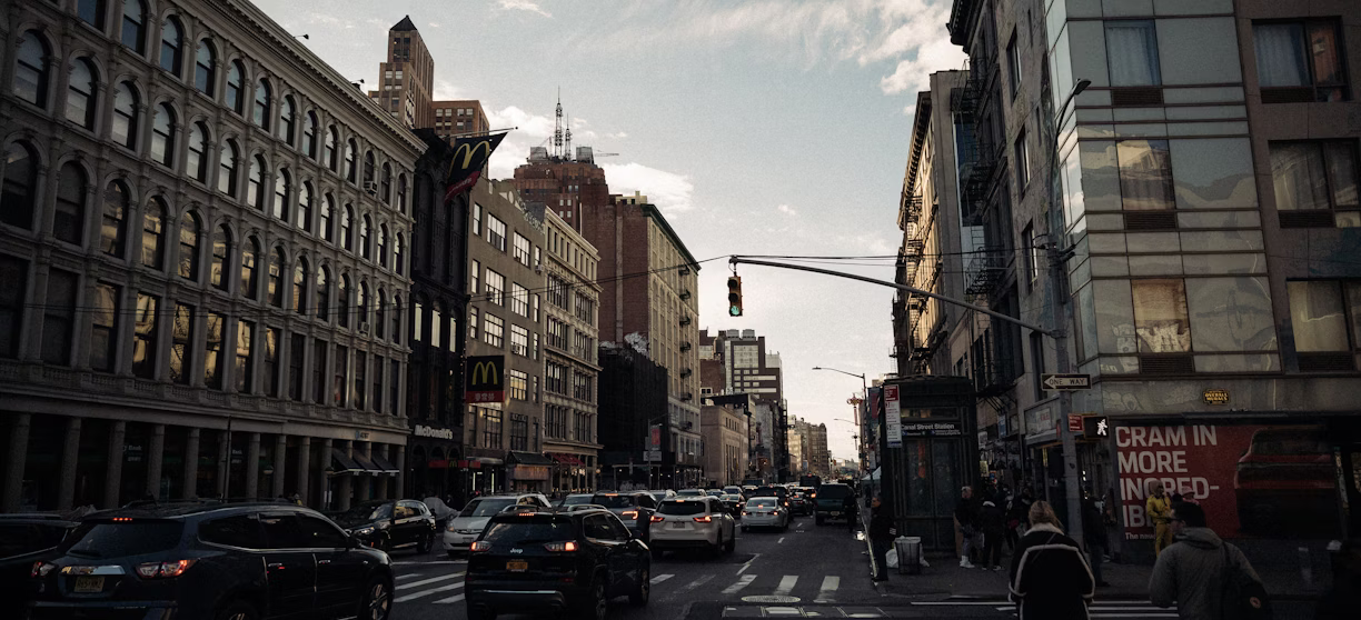 A city street filled with lots of traffic A city street filled with lots of traffic