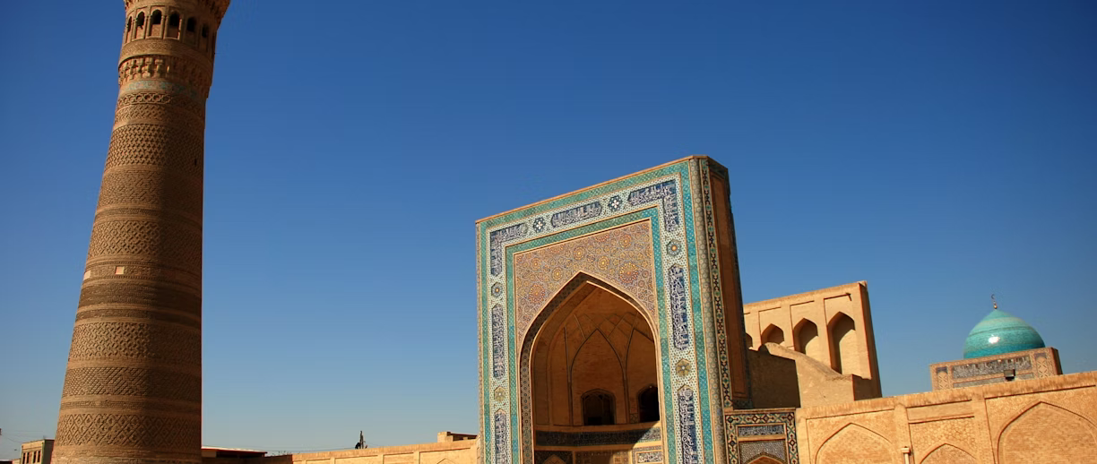 The mosque and minaret of Samarkand, showcasing Uzbekistan's rich history and stunning architectural beauty. The mosque and minaret of Samarkand, showcasing Uzbekistan's rich history and stunning architectural beauty.